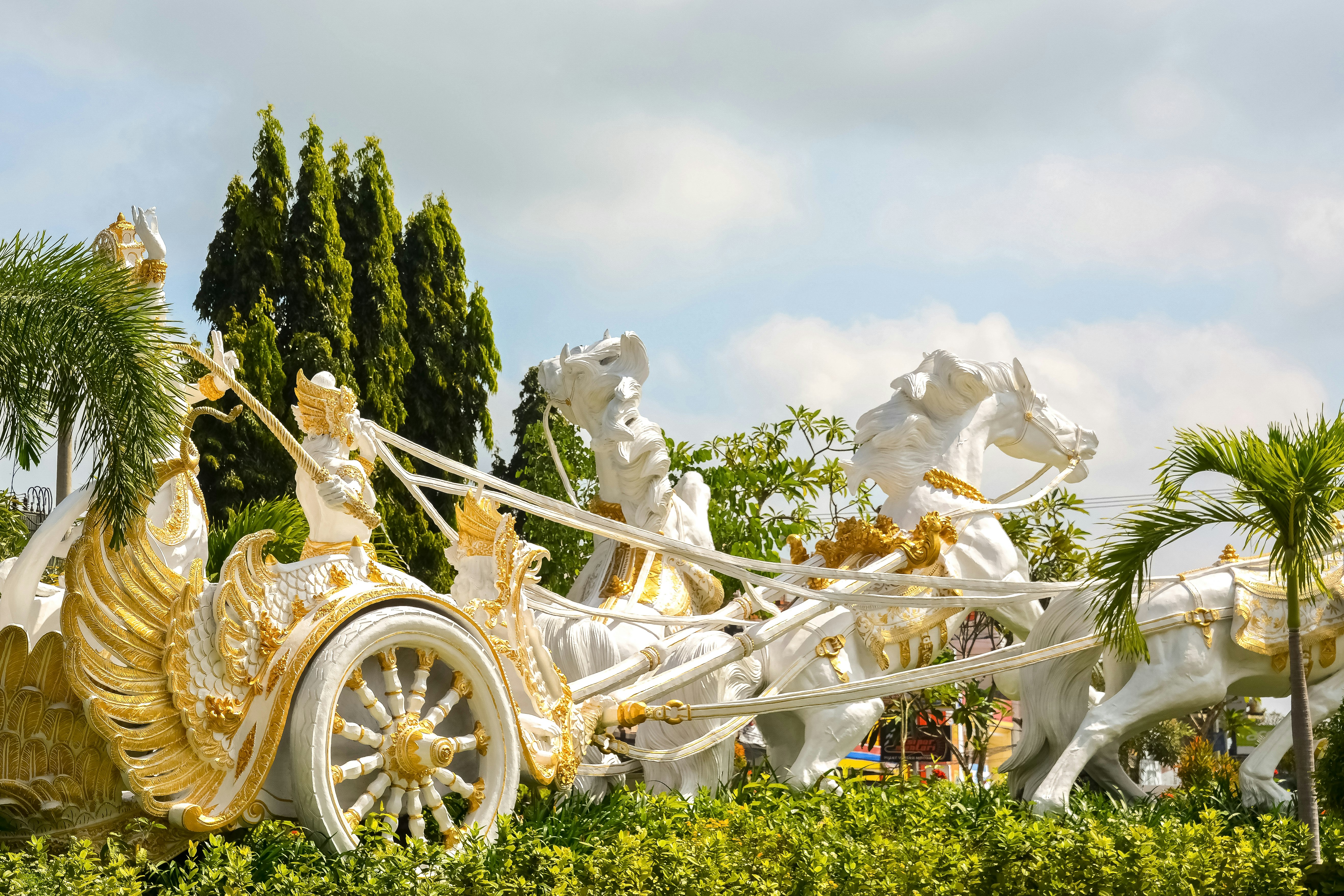 white and gold carriage on green grass field during daytime
